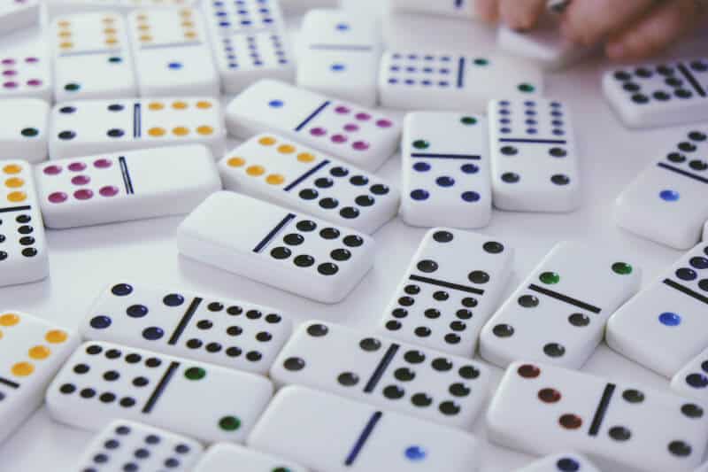 A close-up of dominoes laid out on a table