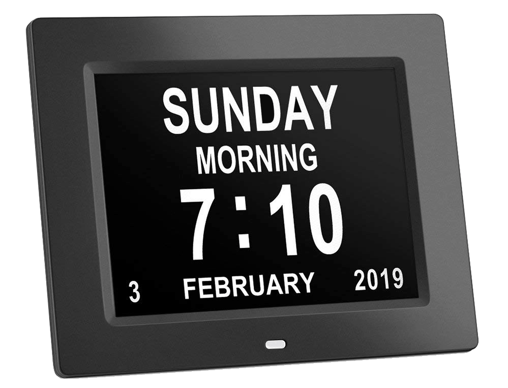 A digital dementia clock showing 'Sunday morning, 7:10, 3 February' in large white letters and numbers on a black screen